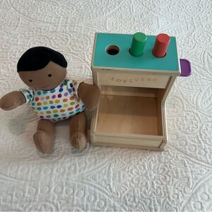 Lovevery bundle of organic cotton doll and wooden peg drop toys